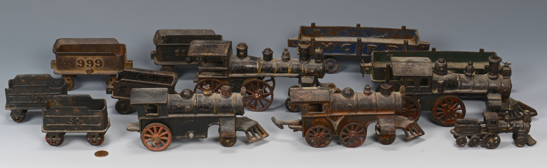 Lot 472: Group of 12 Cast Iron Trains, Cars