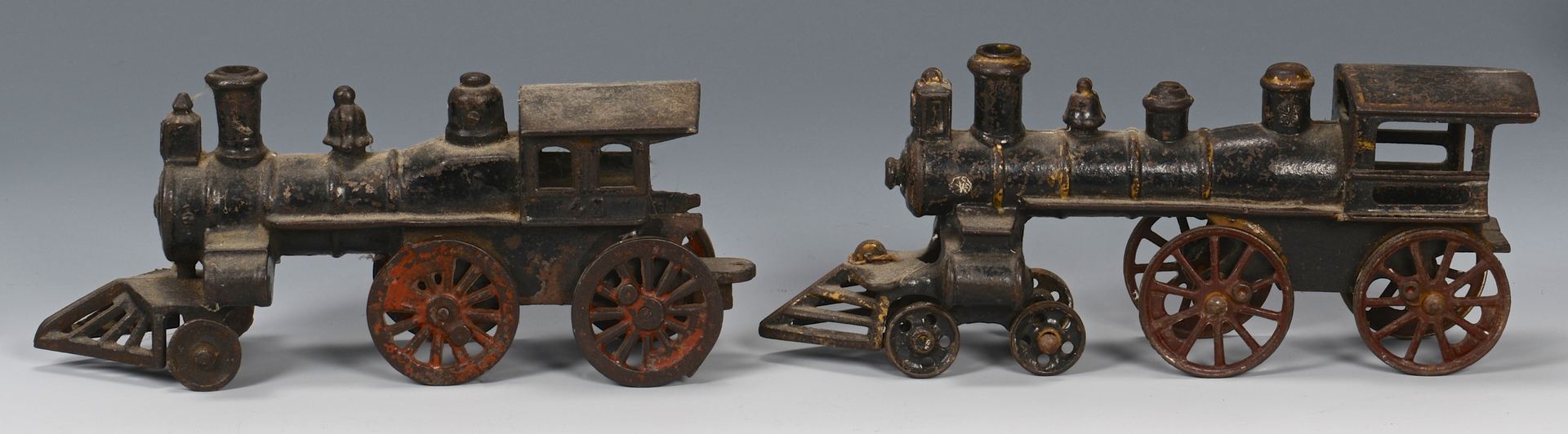 Lot 472: Group of 12 Cast Iron Trains, Cars