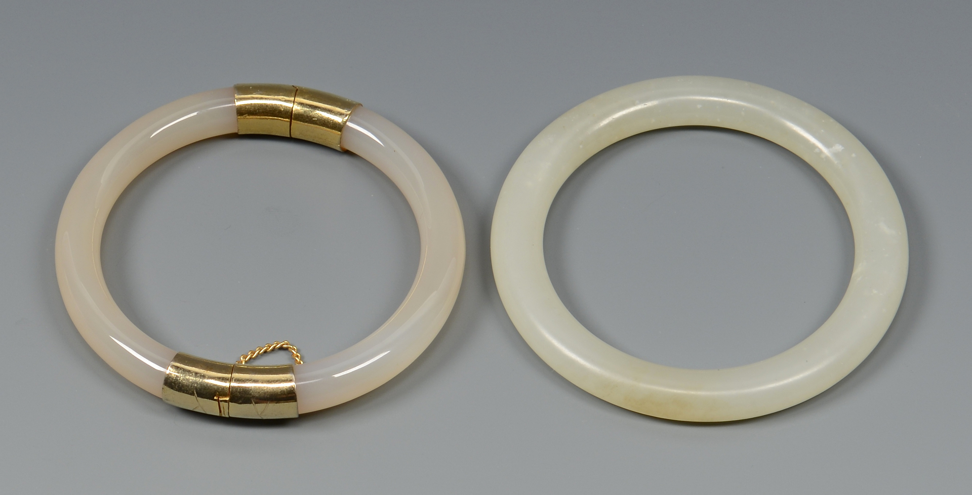 Lot 575: Pair White Jade Bangle Bracelets