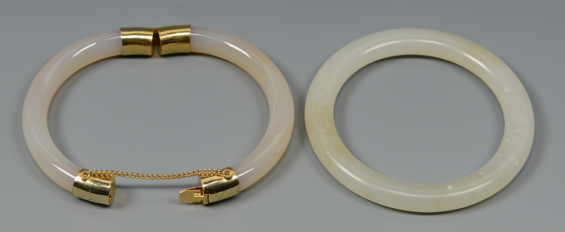 Lot 575: Pair White Jade Bangle Bracelets