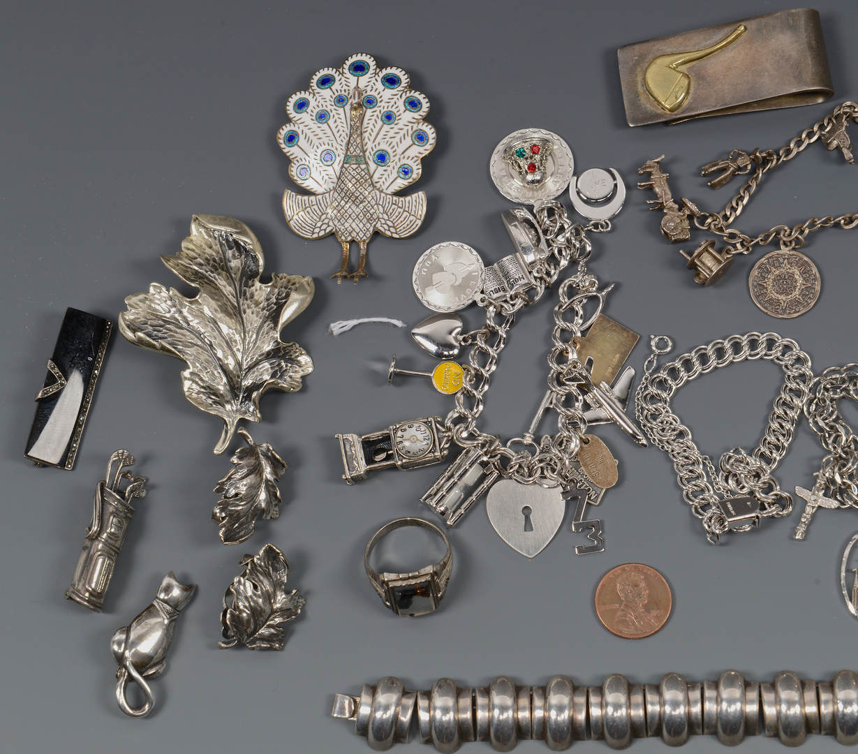 Lot 817: Sterling Charm Bracelets & Novelty Pins