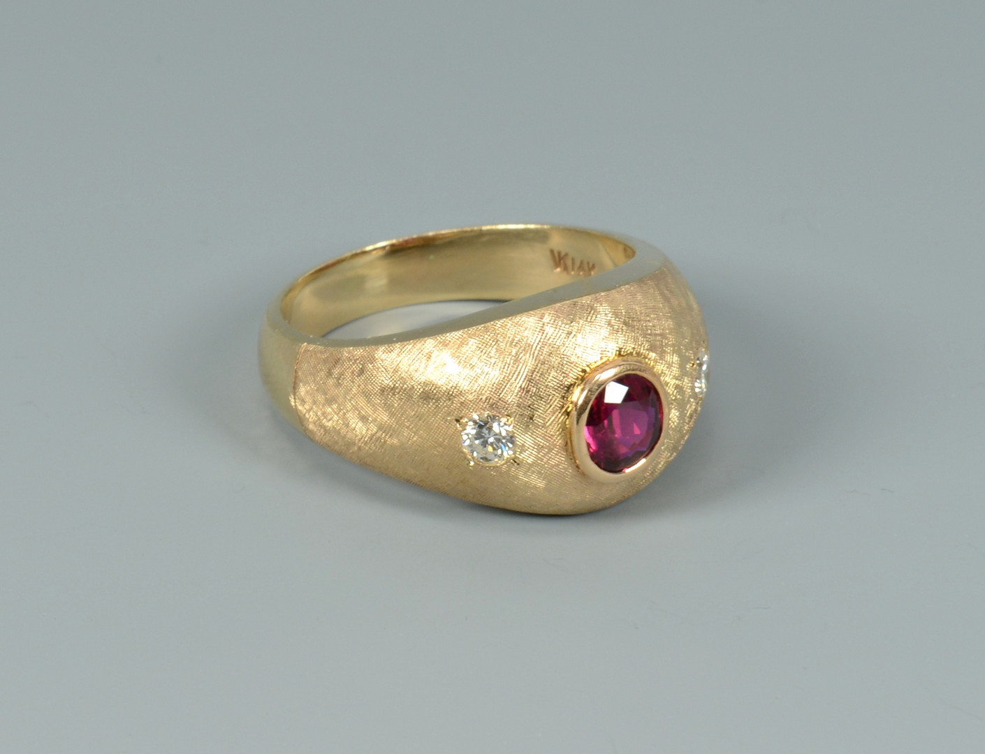 Lot 104: 14k ruby and diamond ring