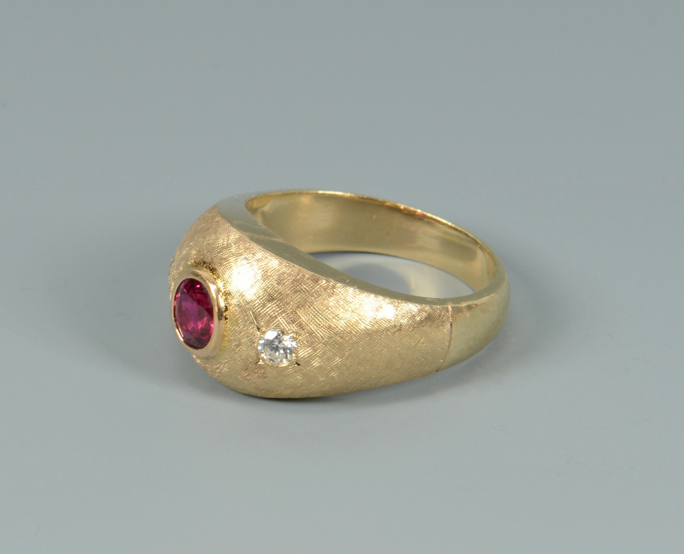 Lot 104: 14k ruby and diamond ring