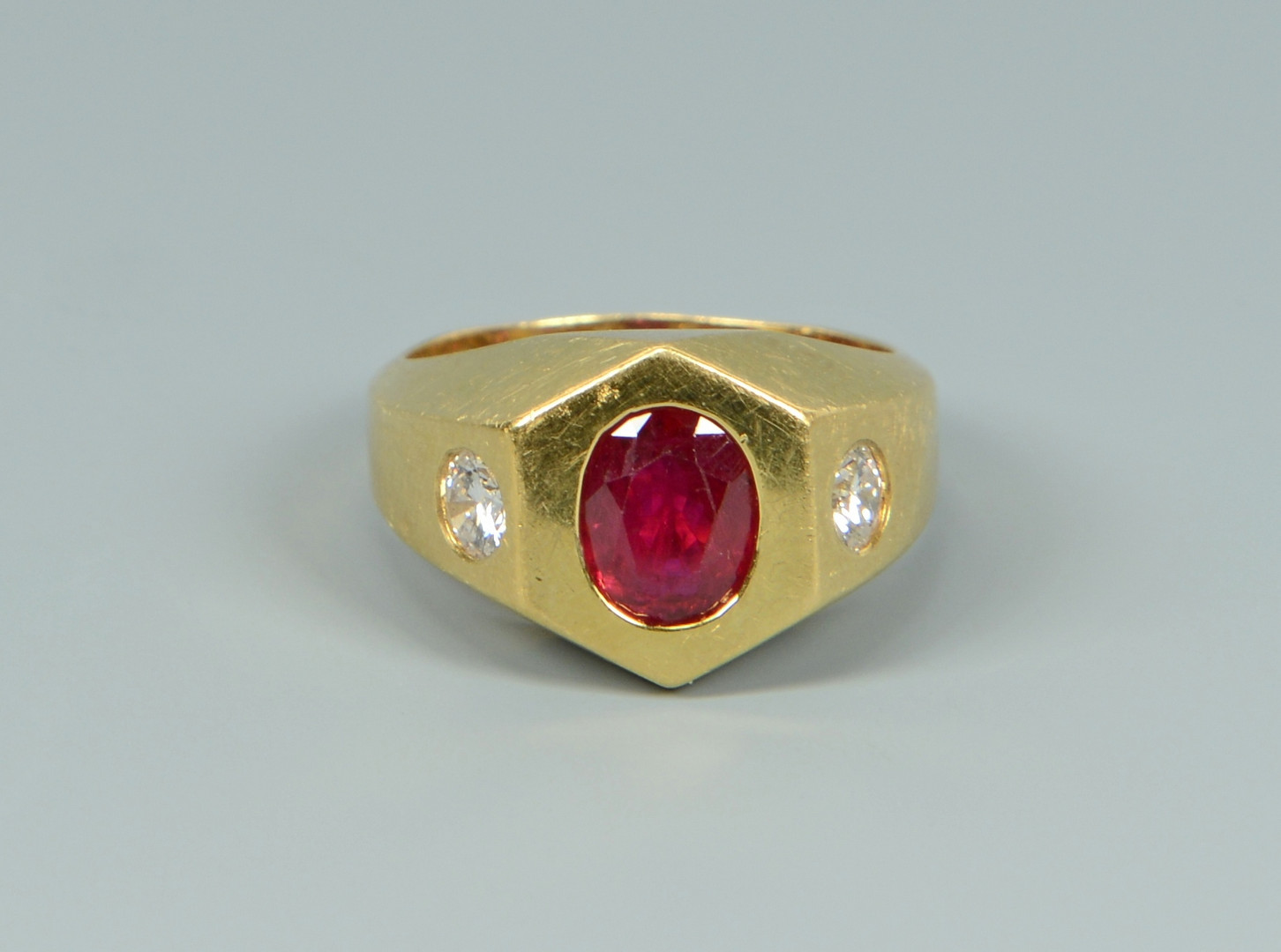 Lot 260: 18k ruby and diamond ring