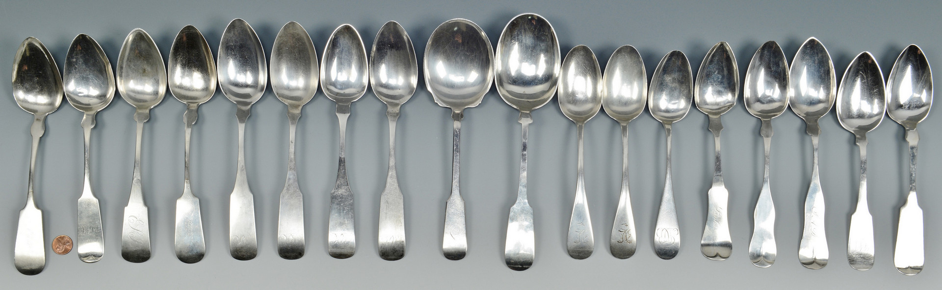 Lot 510: 18 Silver Table and Serving Spoons