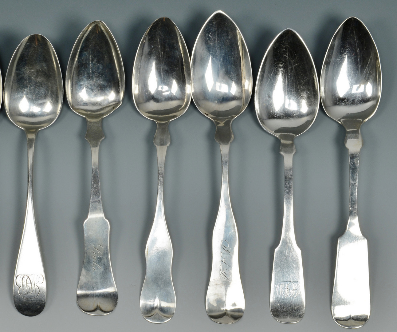 Lot 510: 18 Silver Table and Serving Spoons