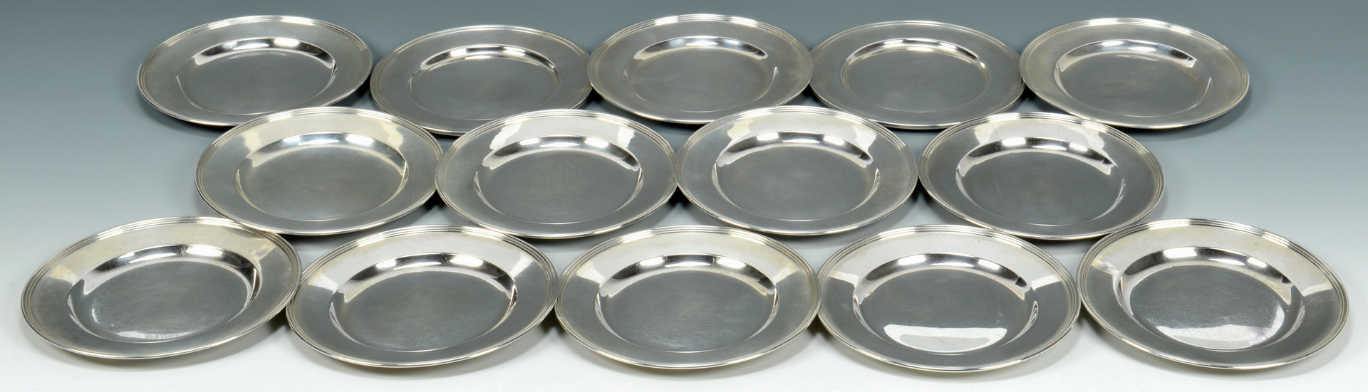 Lot 689: 14 Sterling Silver Bread Plates