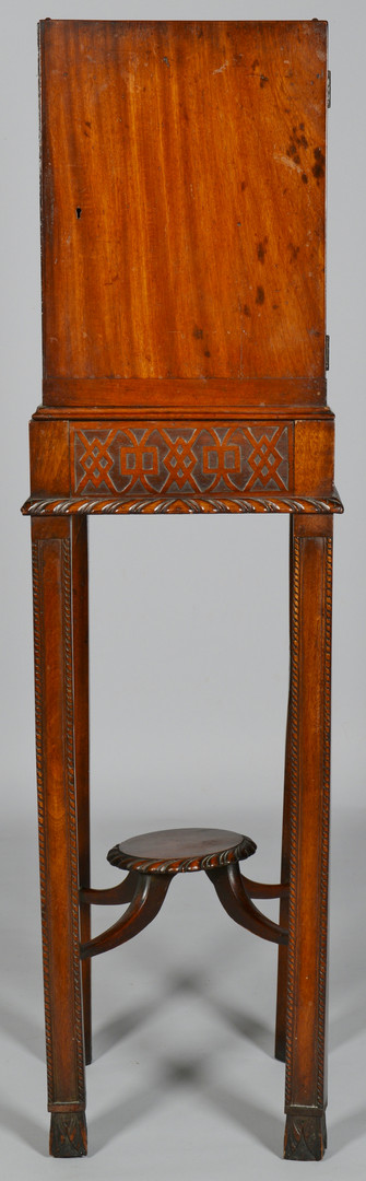 Lot 827: Chippendale style Cabinet on Stand