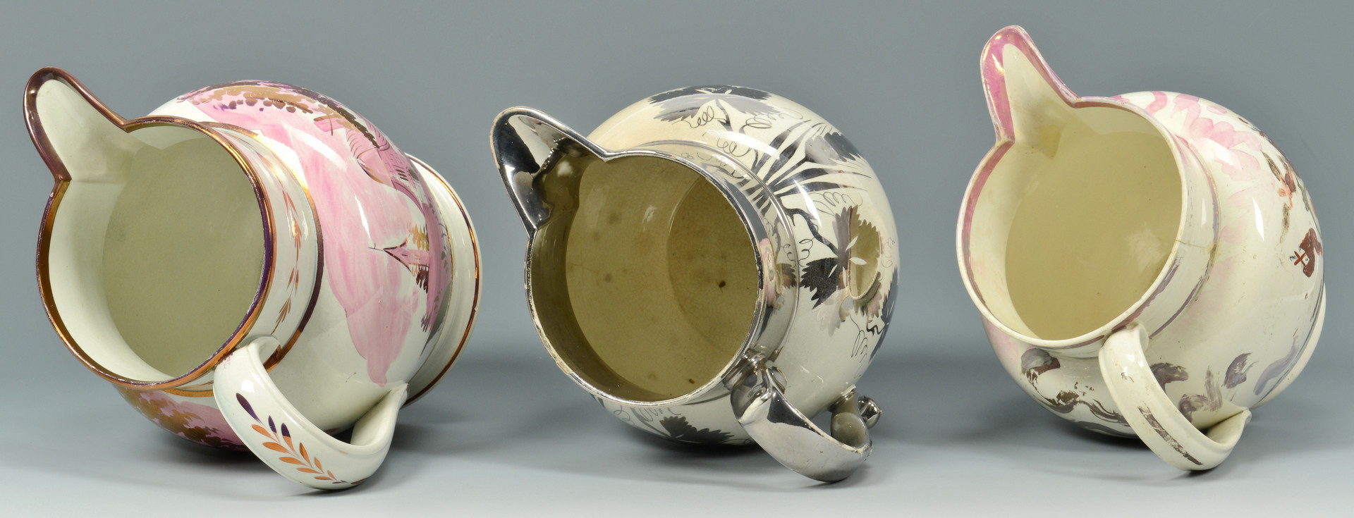 Lot 887: Six Silver and Pink Lusterware Pitchers