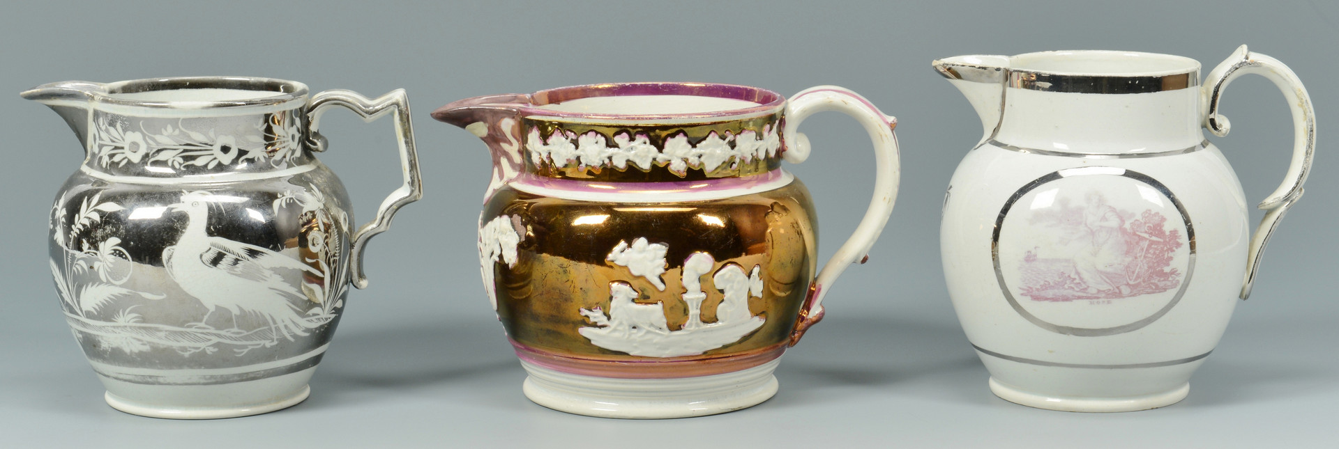 Lot 887: Six Silver and Pink Lusterware Pitchers