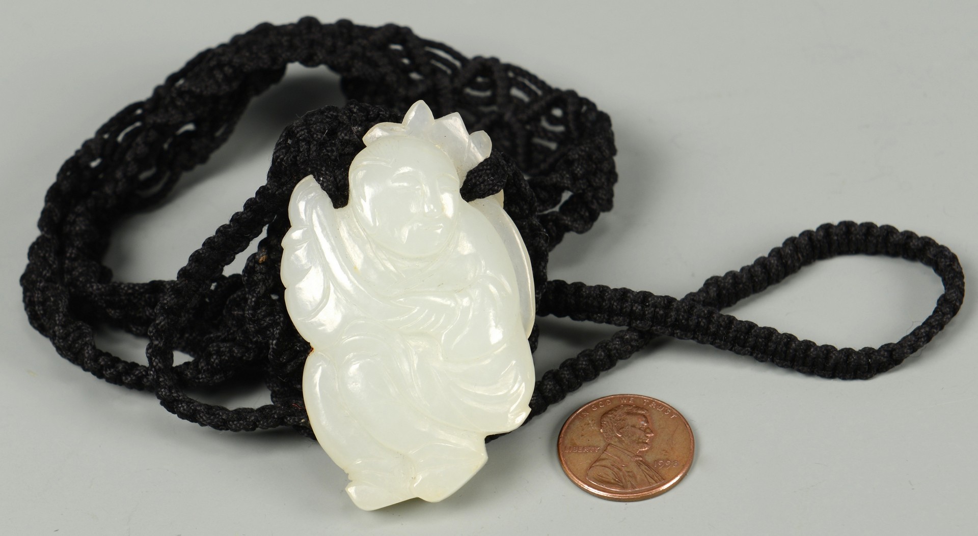 Lot 25: White Jade Buddha Pendant