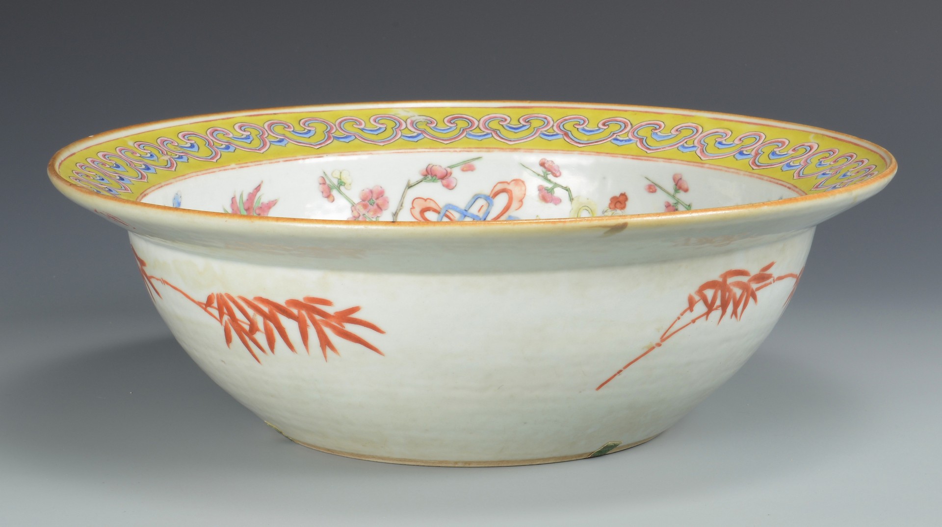 Lot 29: Large Qing Bowl with butterflies, yellow rim