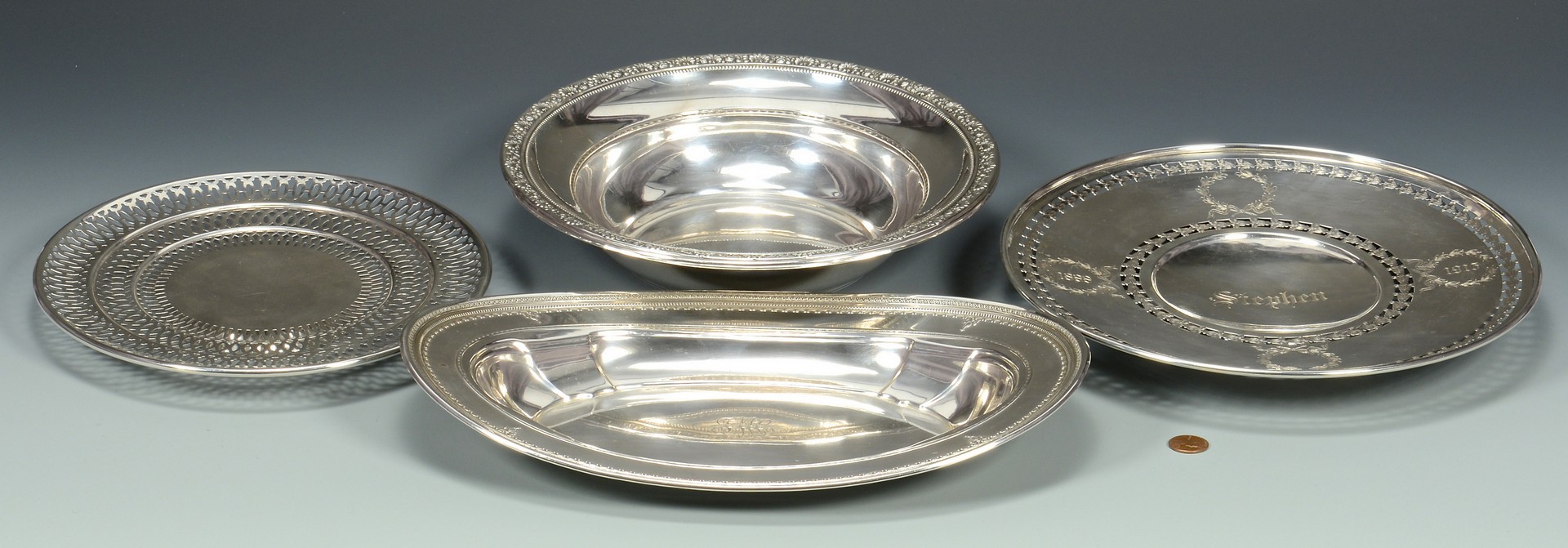 Lot 679: 4 Sterling Silver Serving Items