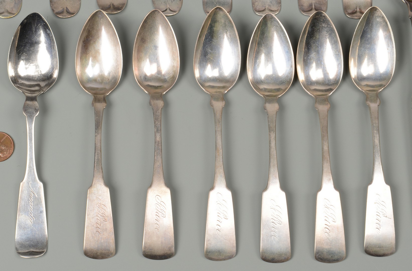 Lot 682: 21 Silver Table and Serving Spoons.