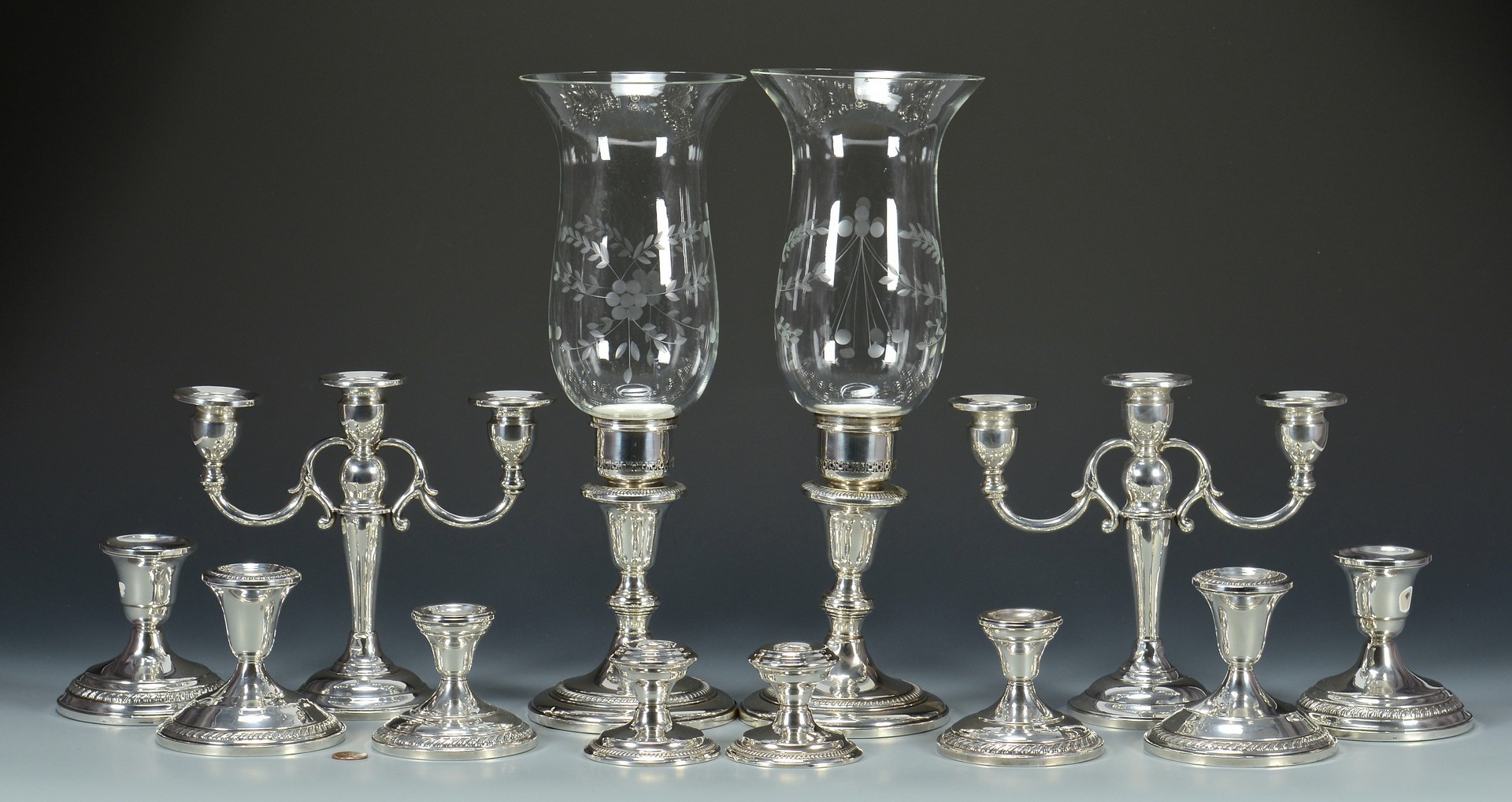 Lot 823: 6 Pair Sterling Wtd. Candlesticks