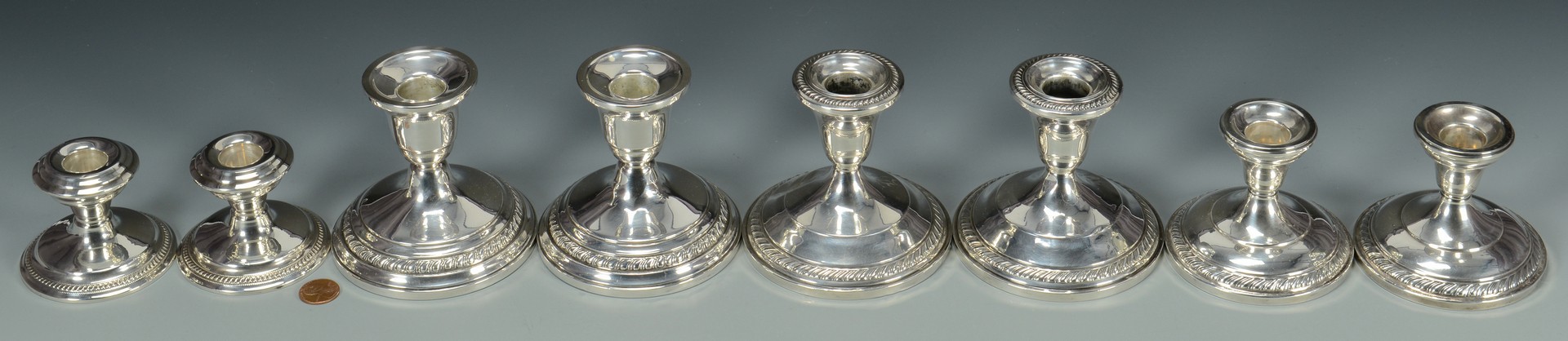 Lot 823: 6 Pair Sterling Wtd. Candlesticks