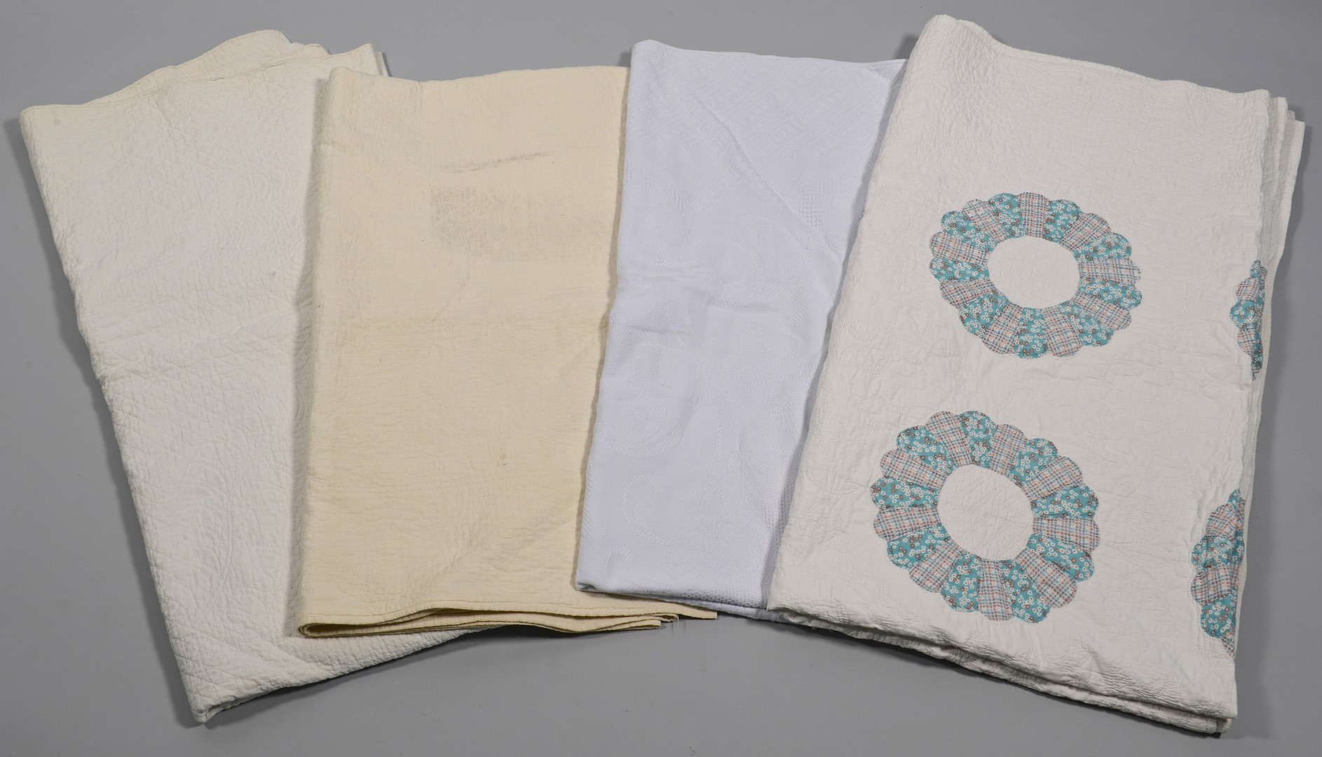 Lot 850: 3 quilts and 1 coverlet, mostly whitework