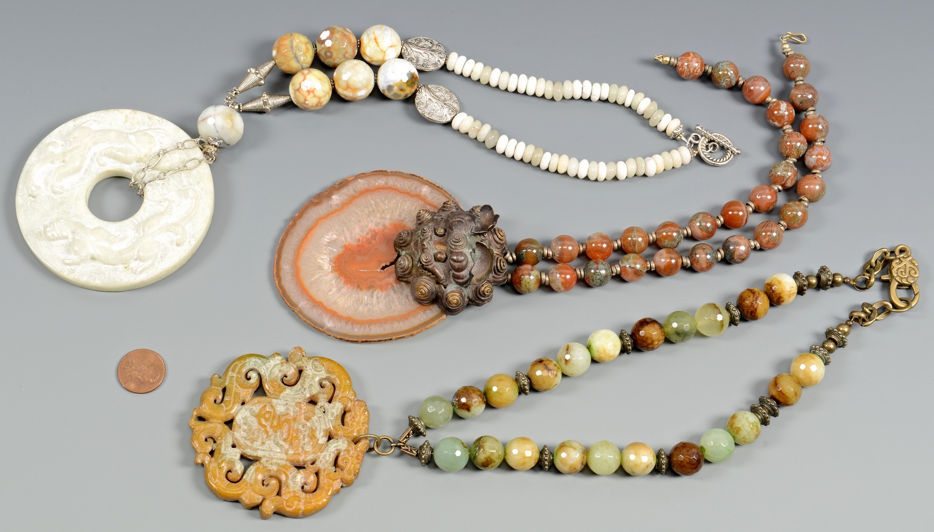 Lot 407: Asian jewelry, 3 necklaces, Earrings, and Bracelet