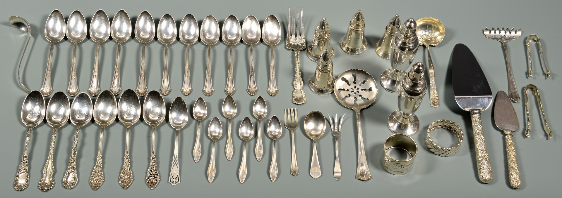 Lot 574: Misc. flatware, napkin rings and salt shakers, 44