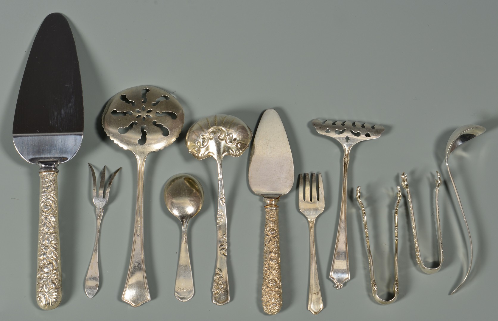 Lot 574: Misc. flatware, napkin rings and salt shakers, 44