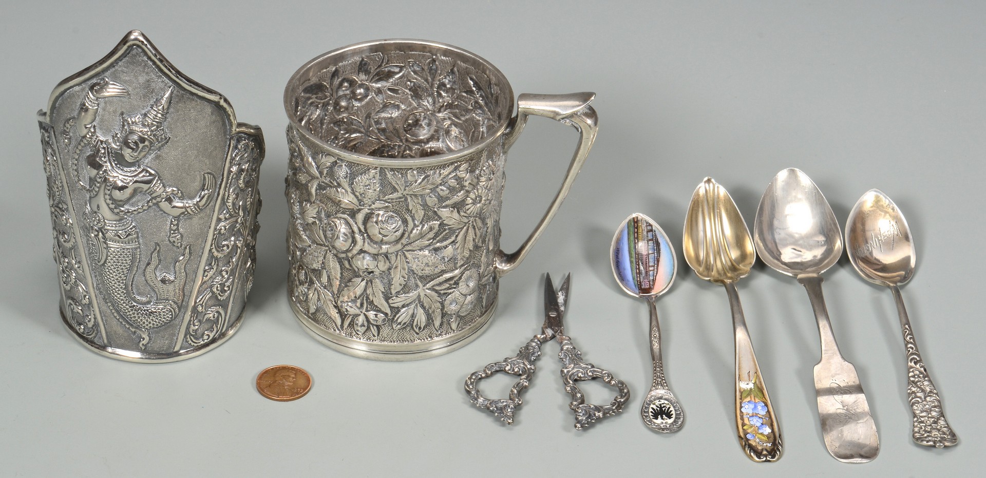 Lot 580: Sterling Repousse Cup, Asian Cuff, Spoons