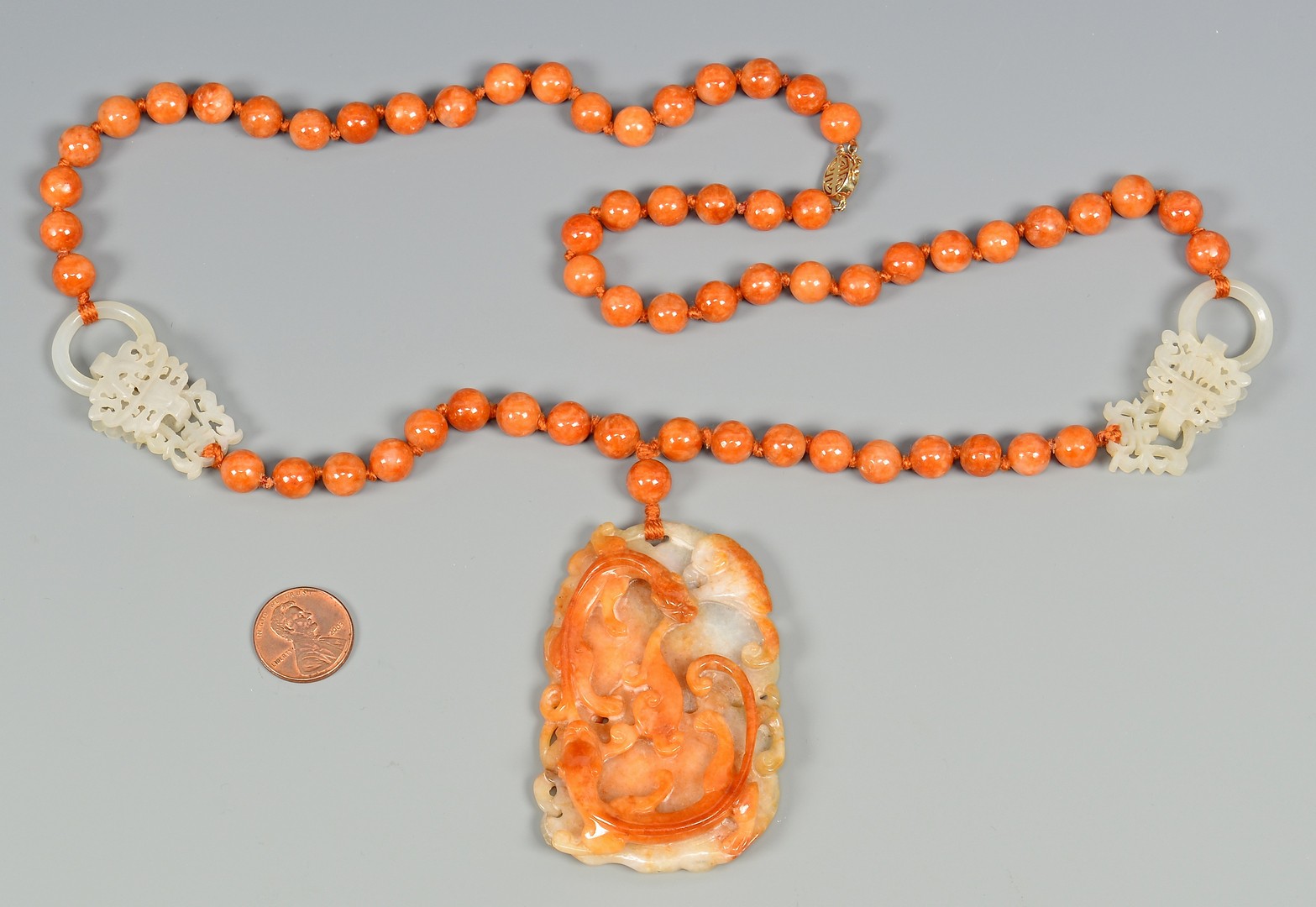 Lot 36: Jade Necklace w/ salamander disk