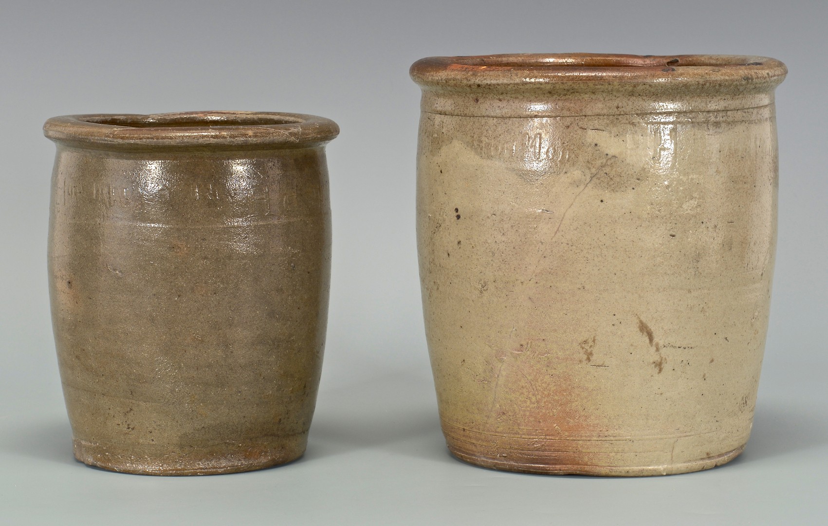 Lot 693: 2 East TN M.P. Harmon Stoneware Jars, 1 upside dow