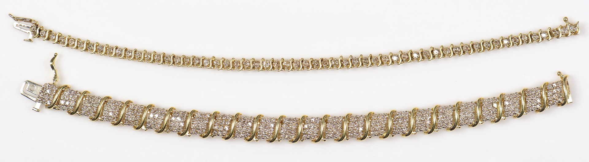 Lot 70: Two 10K Diamond Link Bracelets