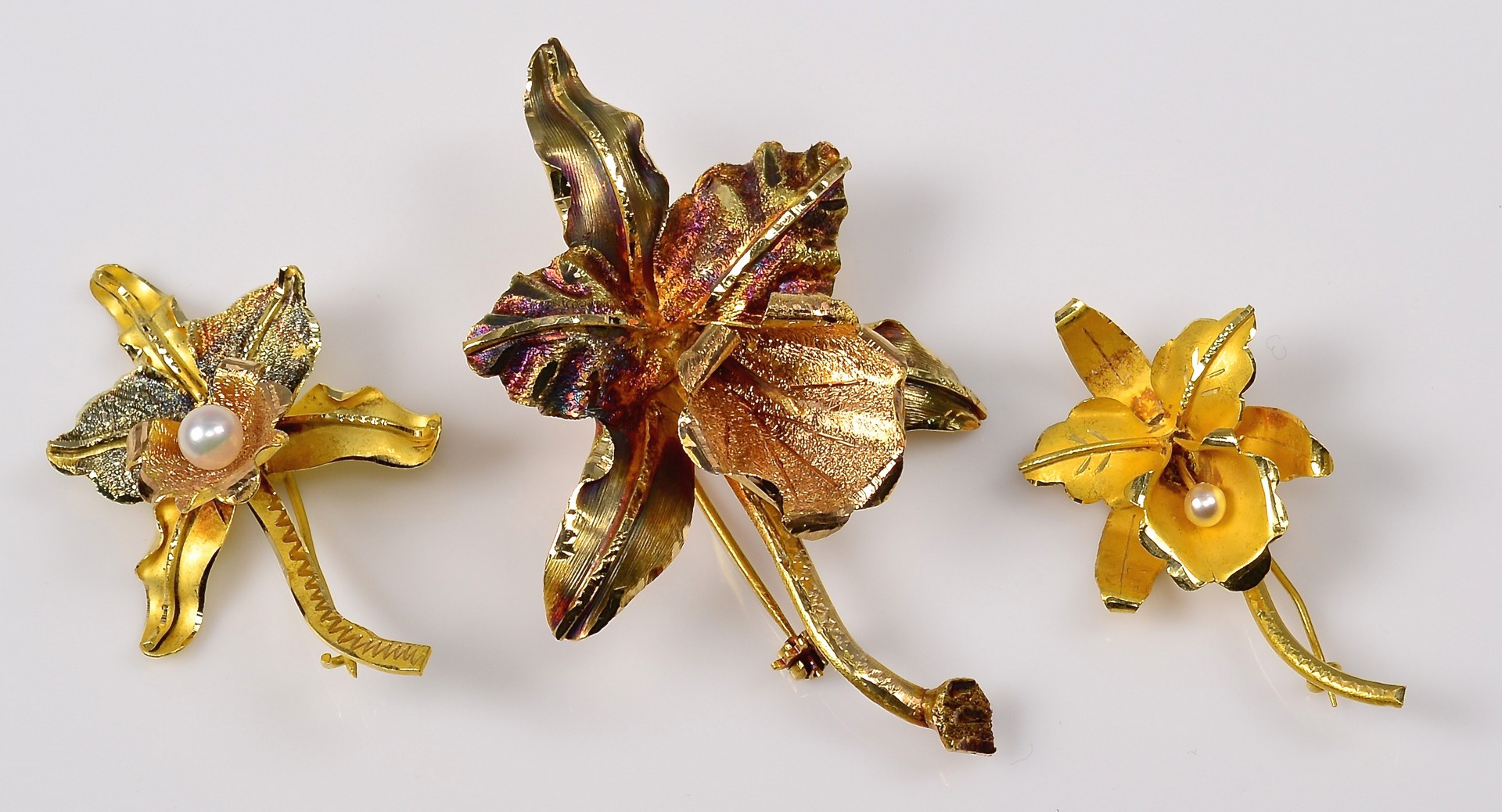 Lot 942: Group of 3 18K Orchid Brooches