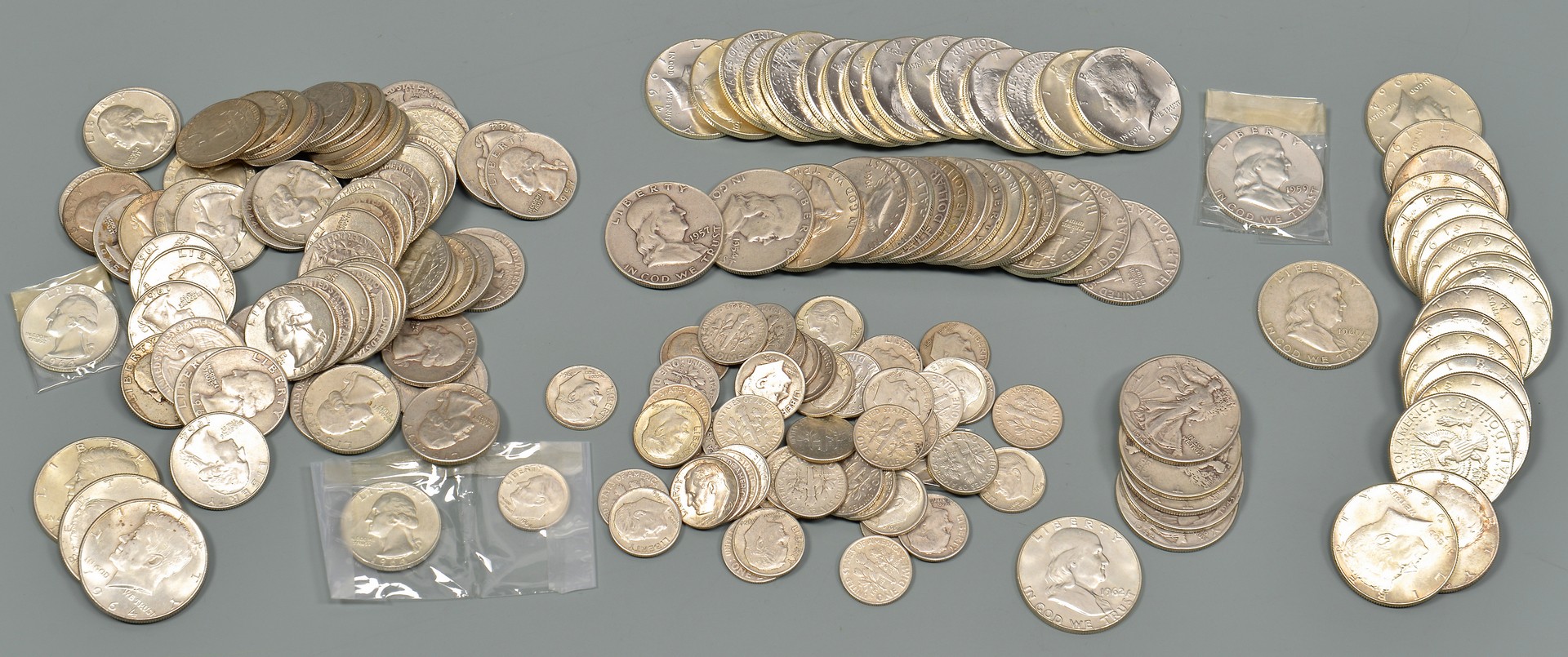 Lot 962: Sixteen 1964 Uncirculated Kennedy Half Dollars