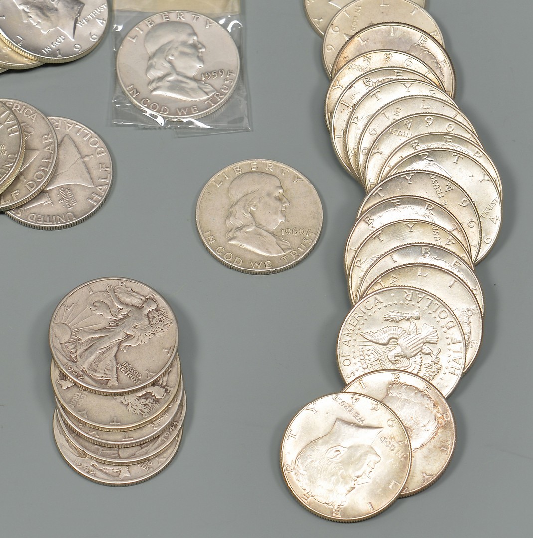 Lot 962: Sixteen 1964 Uncirculated Kennedy Half Dollars