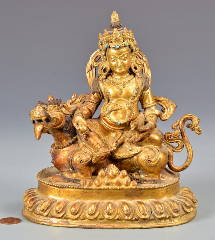 Lot 328: Sino-Tibetan Gilt Bronze Deity on Lion