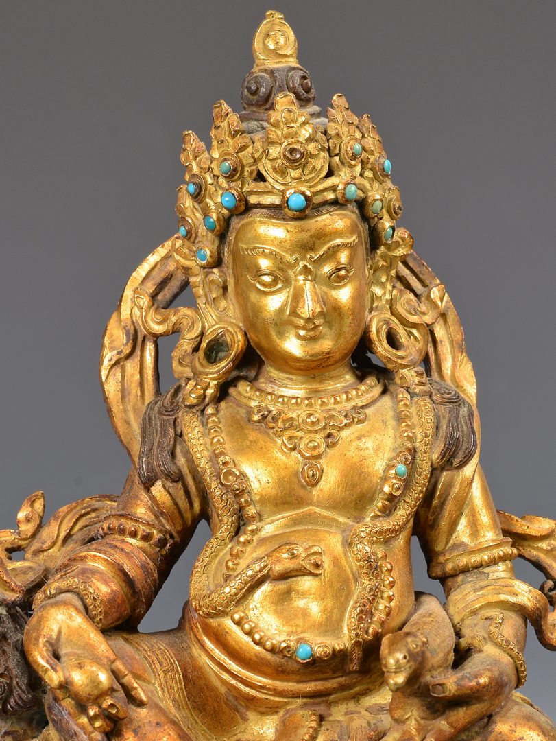 Lot 328: Sino-Tibetan Gilt Bronze Deity on Lion