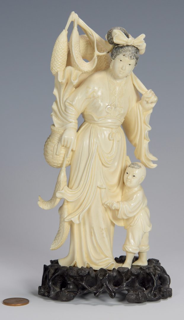 Lot 336: Ivory okimono, woman and child