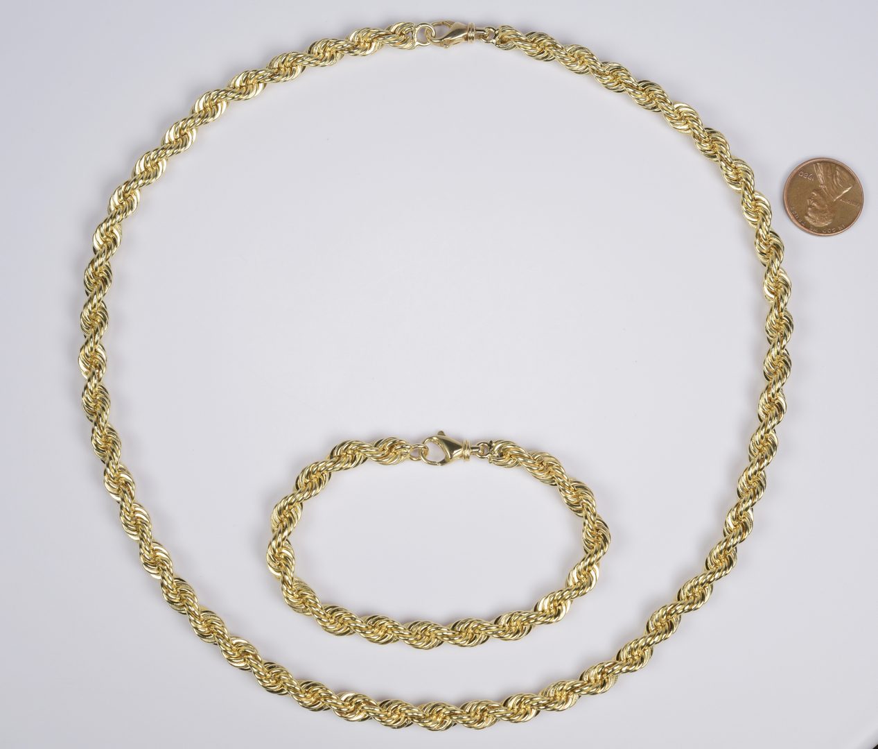Lot 407: 14K Rope Necklace and Bracelet Set, 110 g