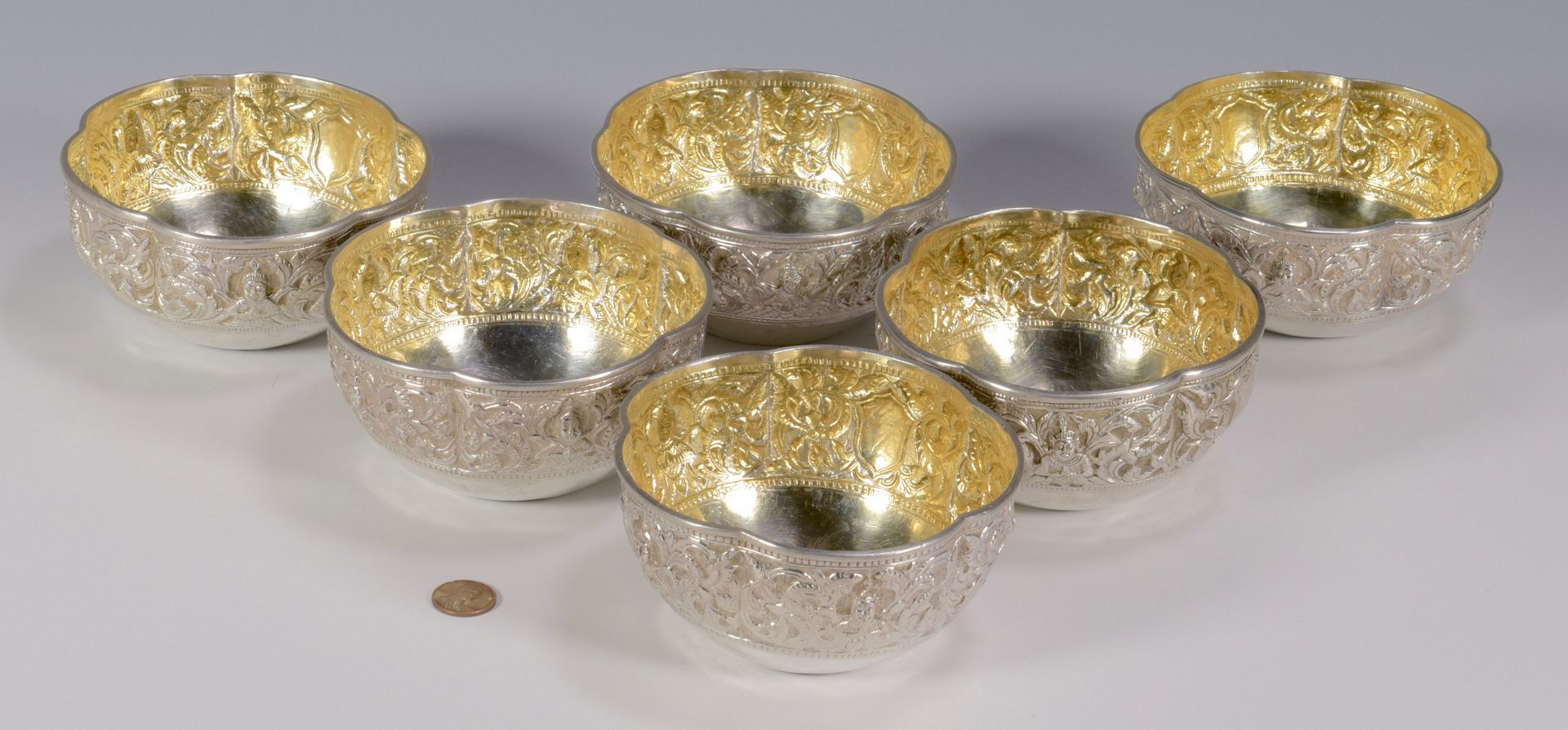 Lot 40: Six Asian Silver Bowls w/gilt interiors