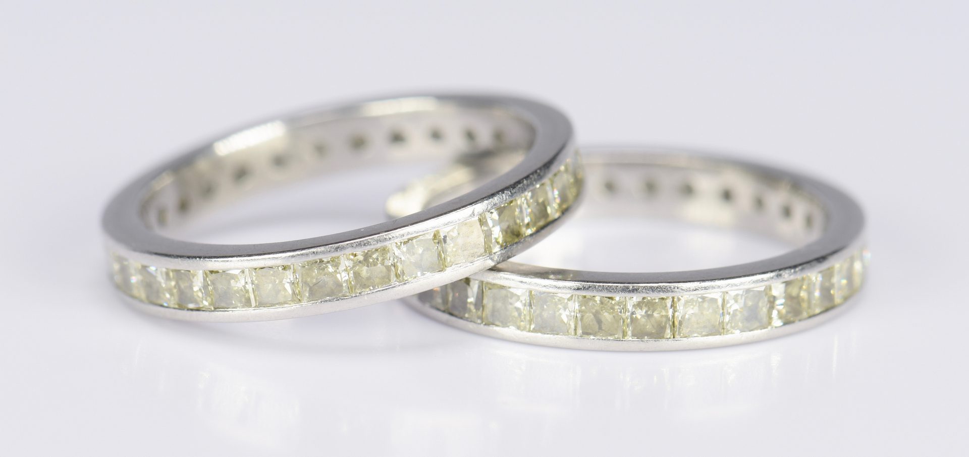 Lot 415: Pair Yellow Diamond Platinum Eternity Rings