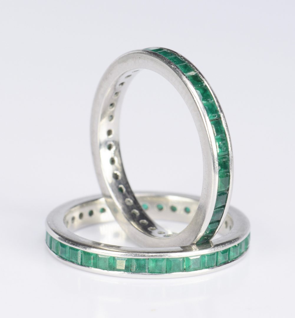 Lot 416: Pair Emerald and Platinum Eternity Rings
