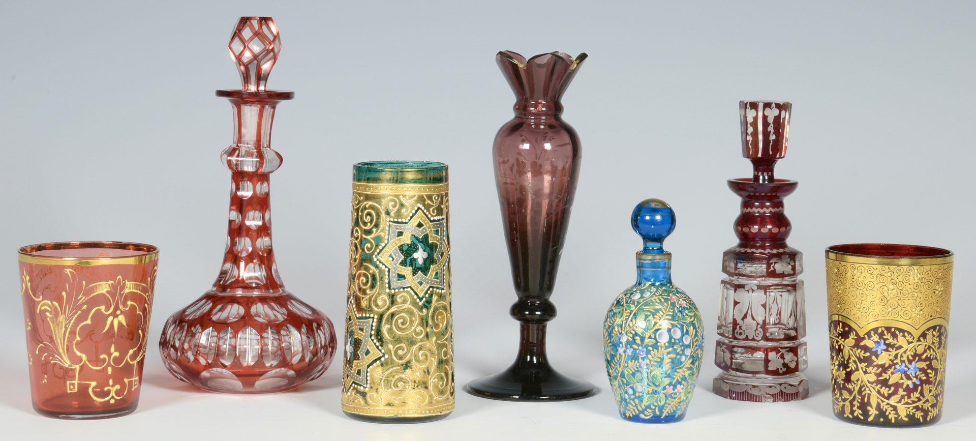 Lot 685: 7 Colored Glass Perfume Bottles and Cups