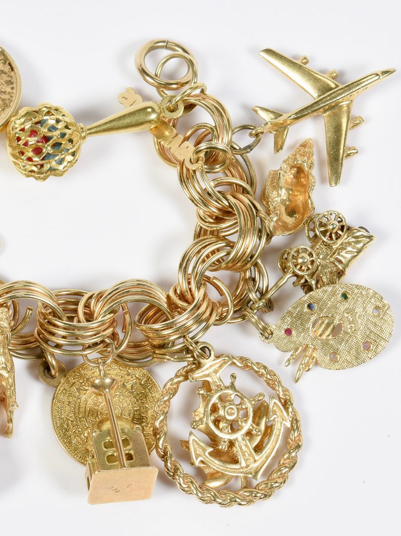 Lot 80: Charm Bracelet, 22  gold charms