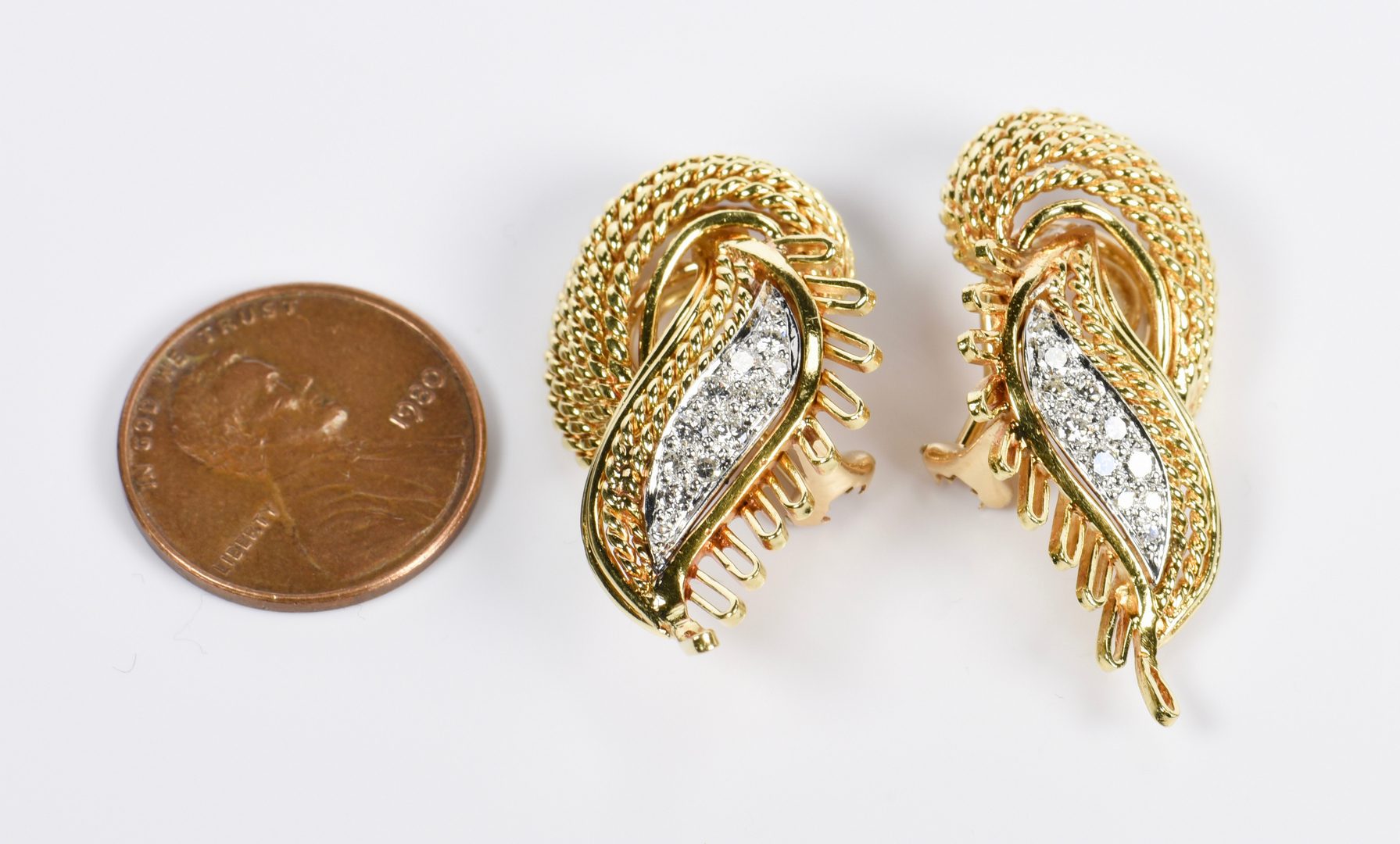 Lot 815: Pair 18K Diamond Twist Earrings