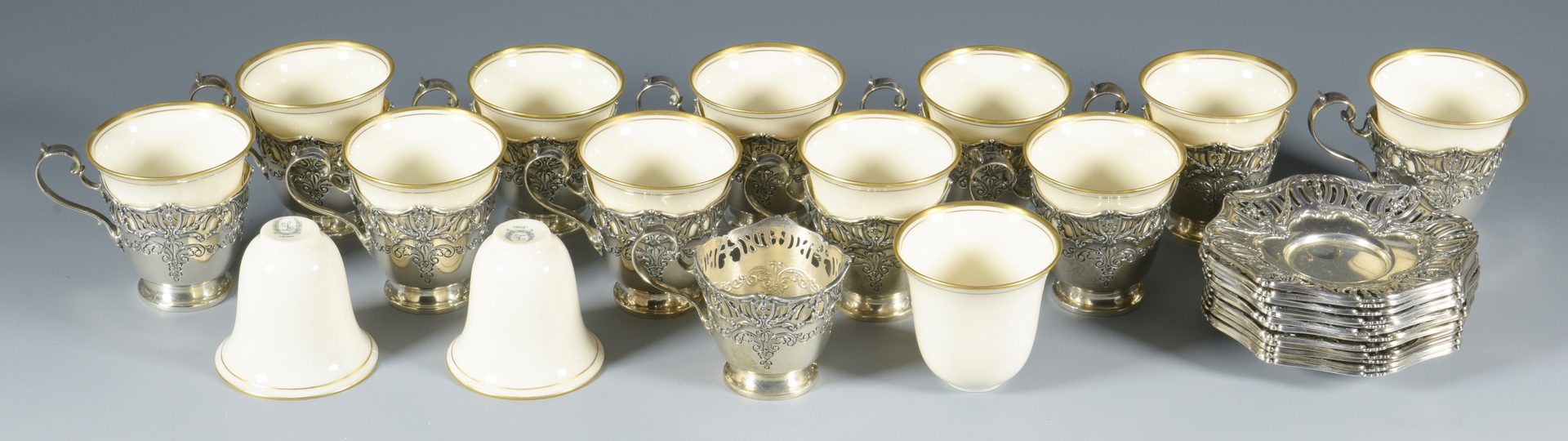 Lot 849: Set Sterling-Porcelain Demitasse Cups and Saucers