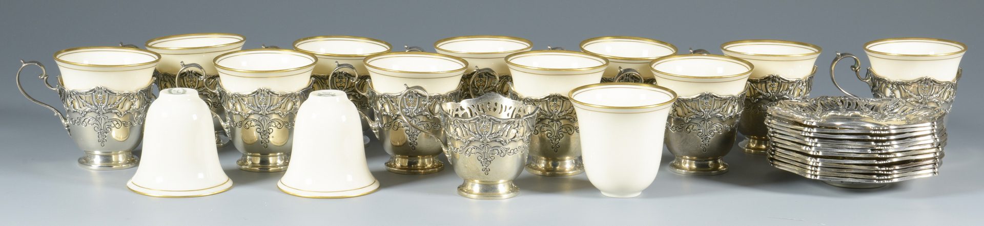 Lot 849: Set Sterling-Porcelain Demitasse Cups and Saucers