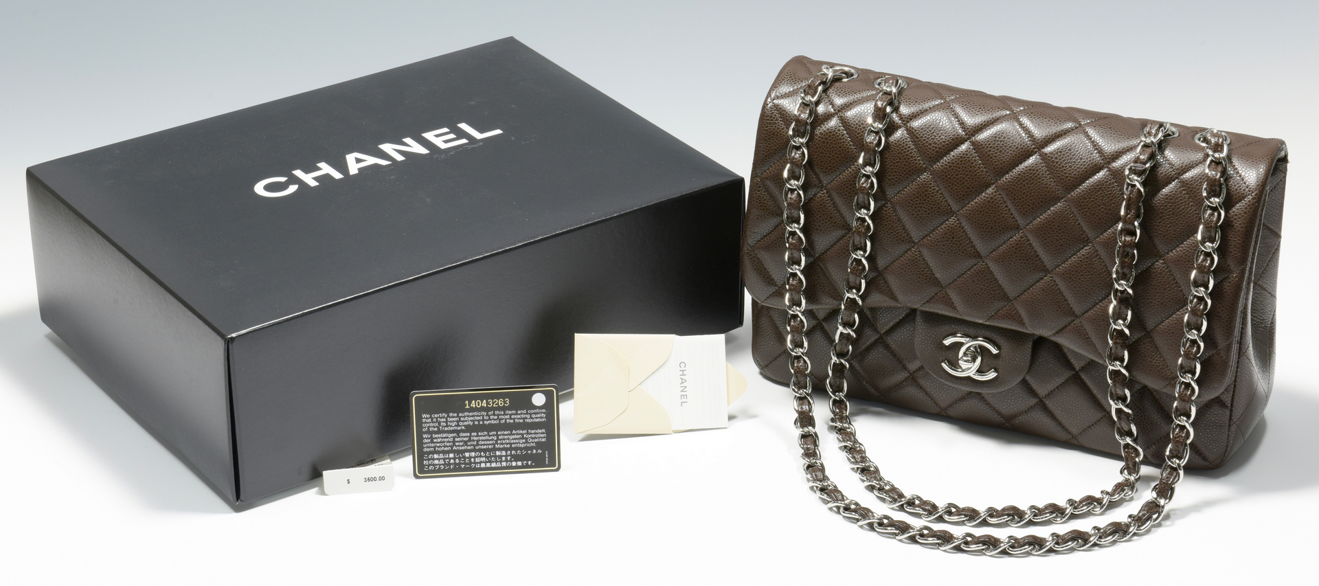 Lot 923: Chanel Jumbo Classic Flap Bag, Dark Brown Leather | Case Auctions