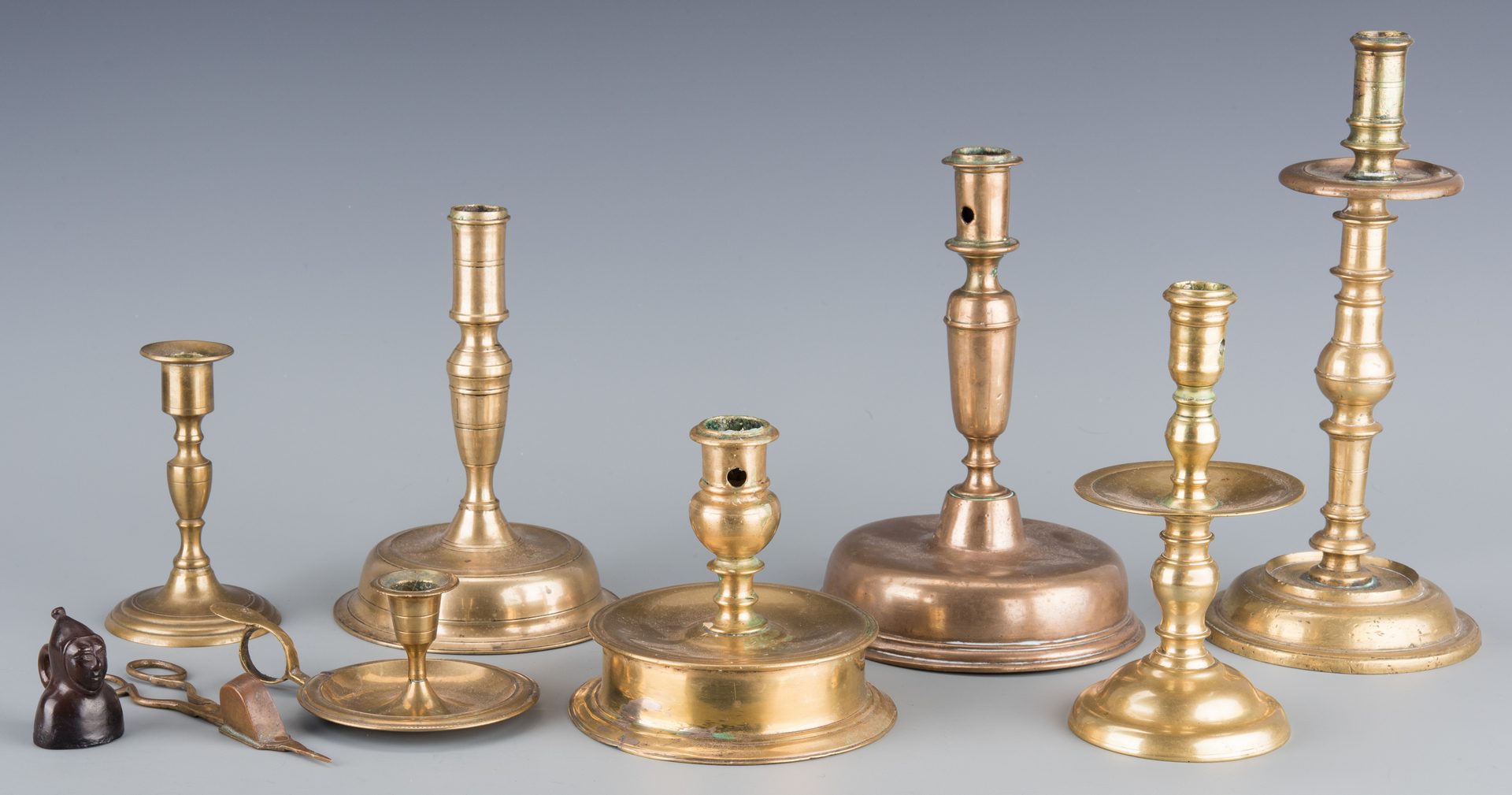 Lot 144: Group early Brass Candlesticks and Horse Brasses