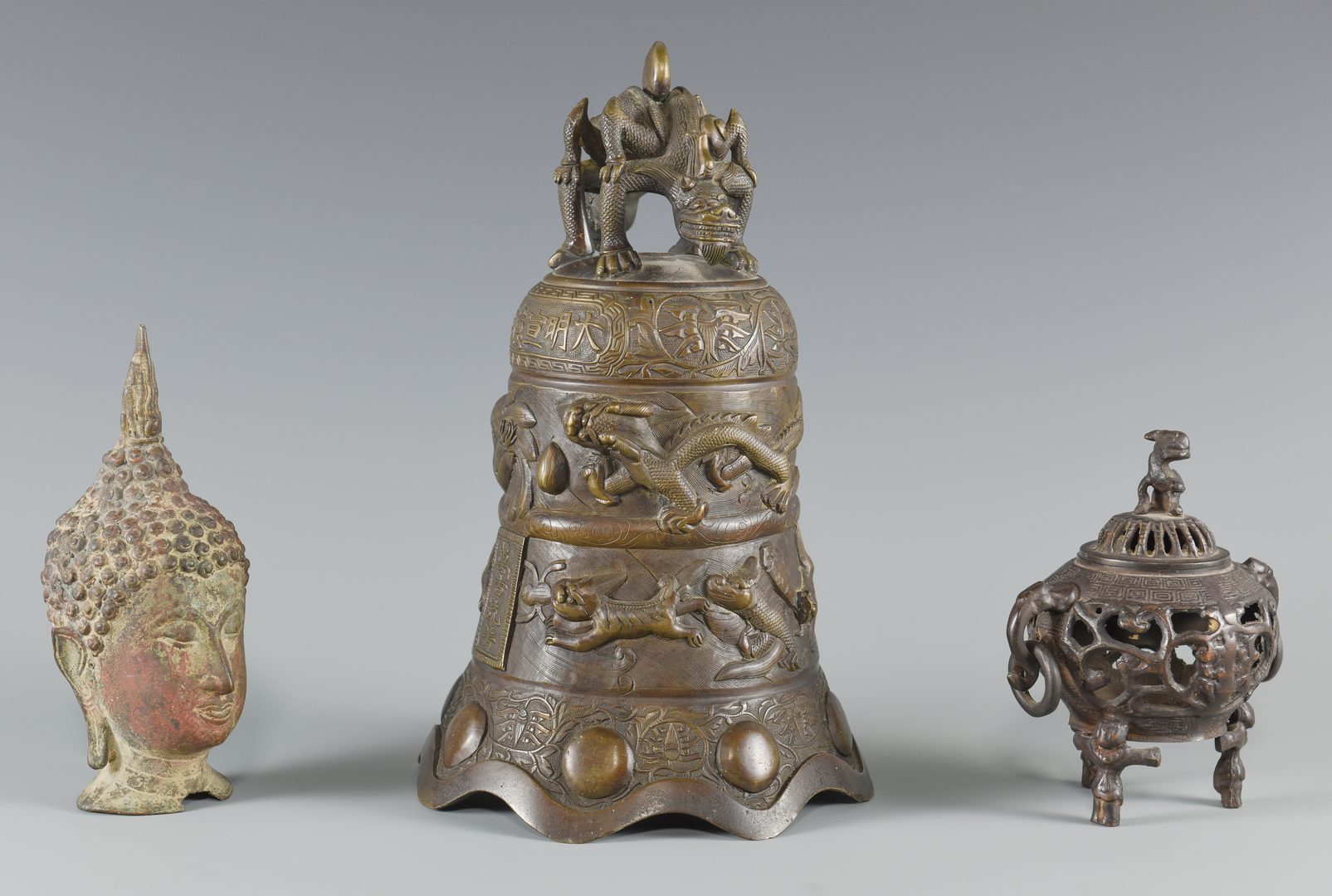 Lot 15: Asian bronze bell, censer, head