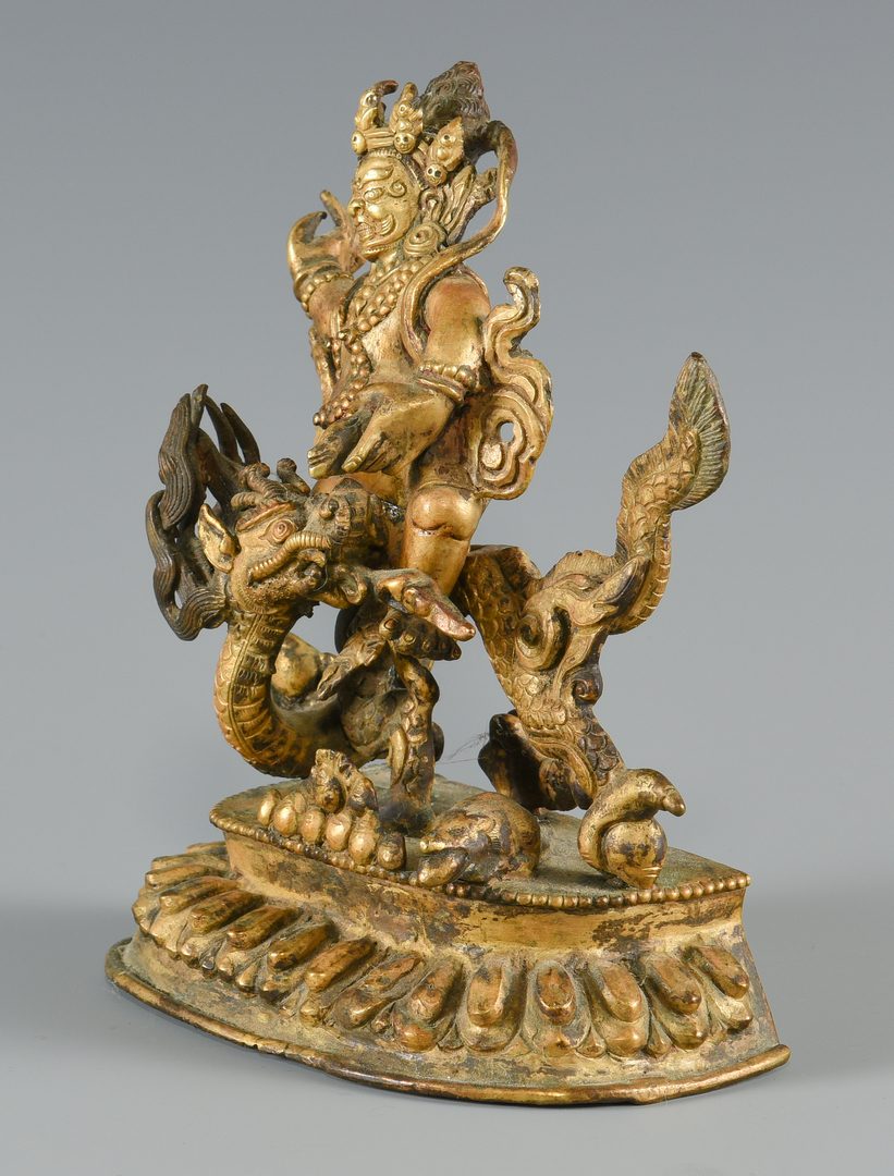 Lot 252: Gilt bronze figure on dragon