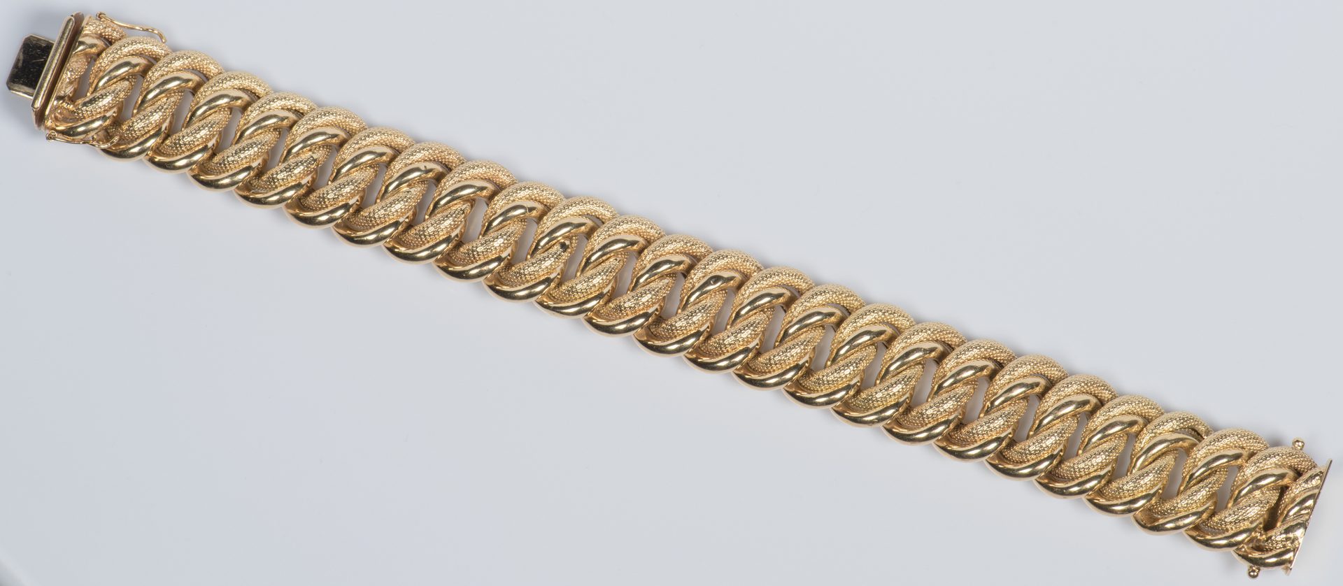 Lot 58: 18K Wide Link Bracelet, 65.2 grams