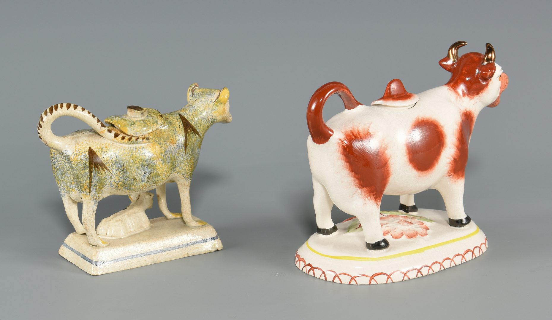 Lot 613: Two Staffordshire Cow Creamers inc. Pearlware