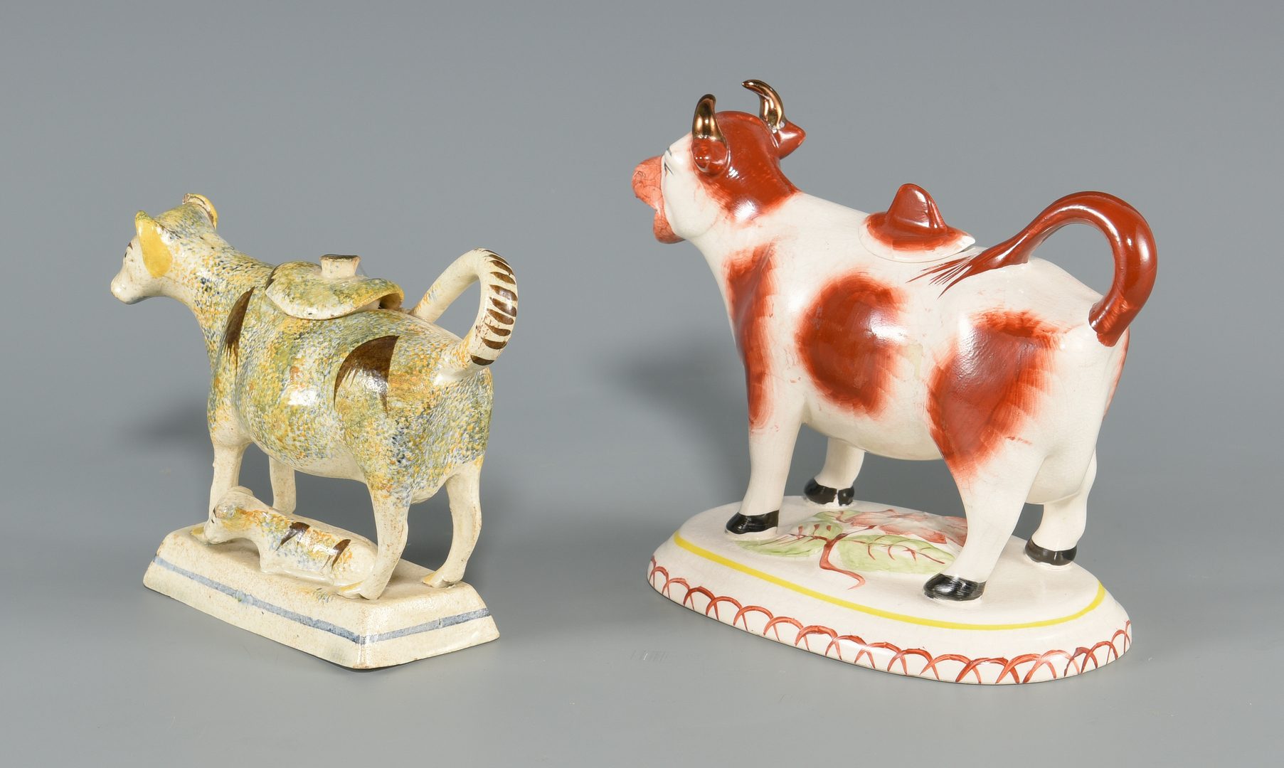 Lot 613: Two Staffordshire Cow Creamers inc. Pearlware